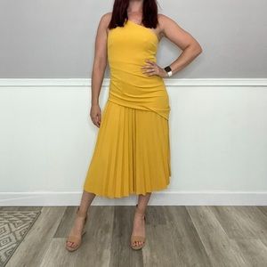 Pleated mustard yellow dress. One shoulder and ruching.